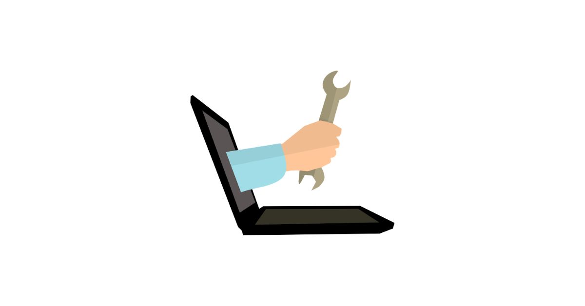 Illustration of a hand holding a wrench coming out of a laptop, representing digital tools for SEO.